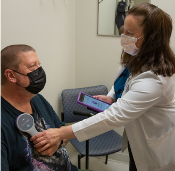 Mary Campagna-Gibson, MD treating a patient