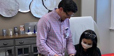 Plastic surgery doctor and patient