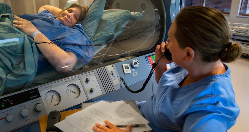 Wound Care & Hyperbaric Medicine Services doctor helping patient