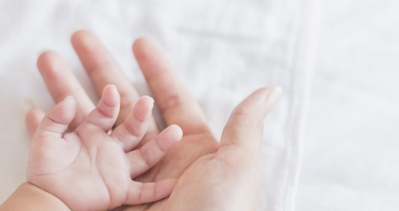 Baby and mother hand