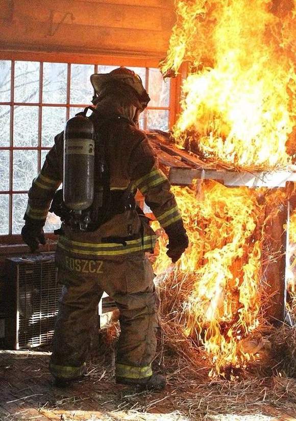 Ken Foszcz, Retired Fire Chief of the Town of Randall, leads a firefighter training exercise.