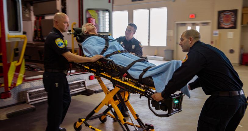 Paramedics helping patient