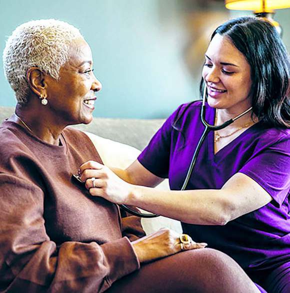 nurse helping patient